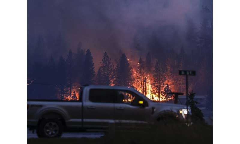 California crews make fire gains; Washington town evacuated