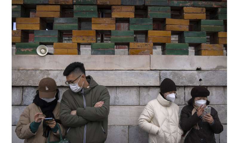 , China tightens restrictions as rise in virus cases reported