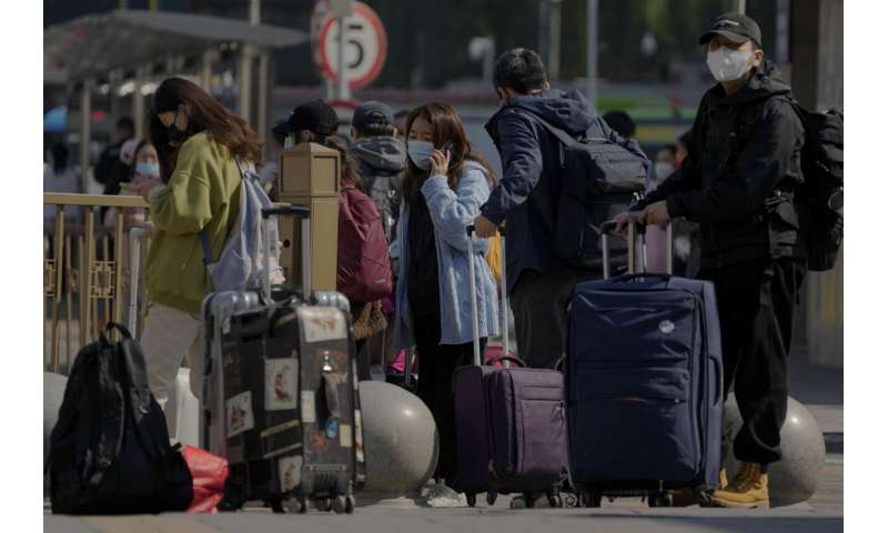 China's vast Xinjiang hit with COVID-19 travel restrictions