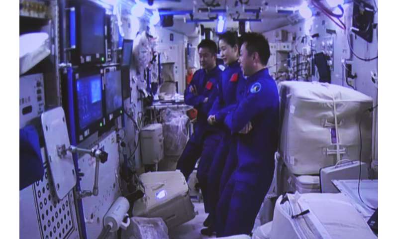 Chinese spaceship with 3 aboard docks with space station
