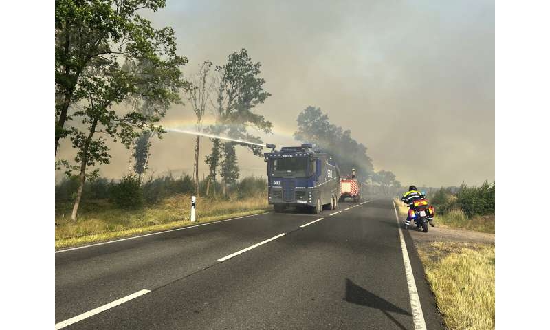 Cooler weather helps Spain with fires; rain helps in Germany