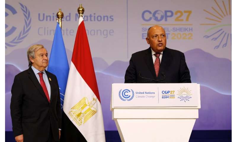 Egypt's Foreign Minister Sameh Shoukry, on the right, speaks as United Nations Secretary General Antonio Guterres stands beside 