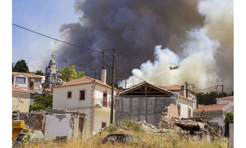 Fire damages homes in southern Greece; more blazes active