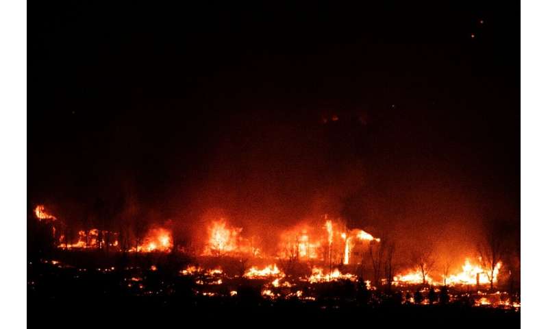 Flames engulf homes as the Marshall Fire spreads through a neighborhood in the town of Superior, Colorado