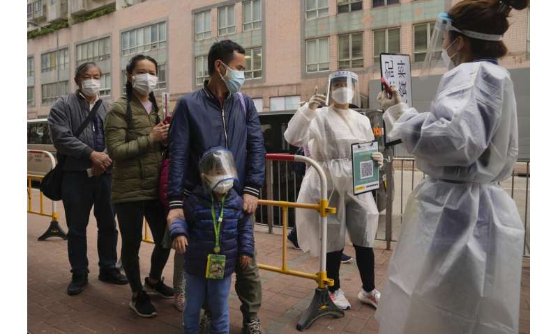 Hong Kong's new virus cases top 10,000 in spiraling outbreak