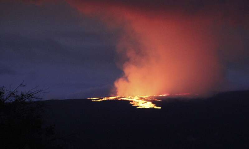 Lava from Hawaii volcano lights night sky amid warnings