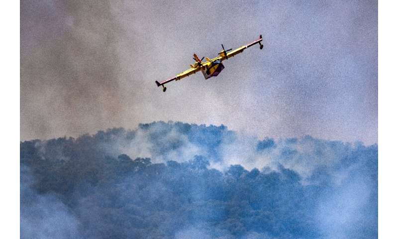 Planes dropped loads of water to extinguish fires tearing through Morroco's terrain