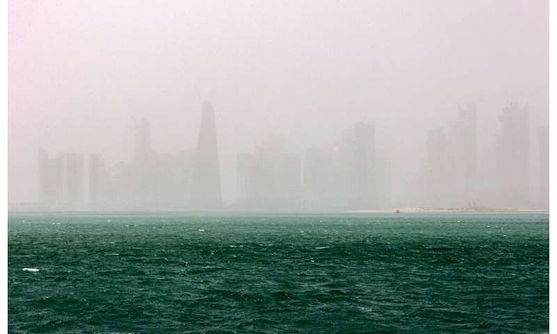 This picture taken on May 17, 2022 shows a view of the haze obscuring the skyline of Qatar's capital Doha during a heavy dust st