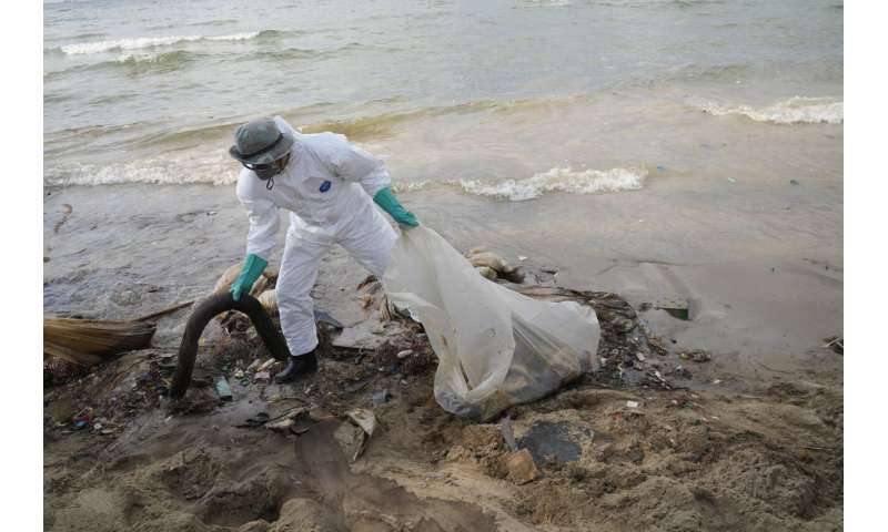 Weather, cleanup keep oil slick away from Thai resort island
