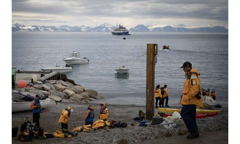Cruise ship tourists leave Ittoqqortoormiit after visiting the Inuit village