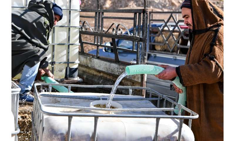 Farmers bring water tanks for their livestock in Ouled Omar