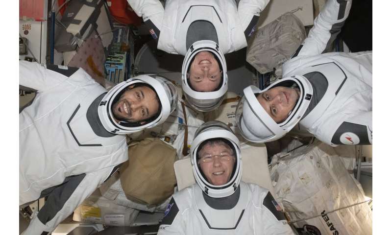 Four astronauts return to Earth in SpaceX capsule to wrap up six-month station mission