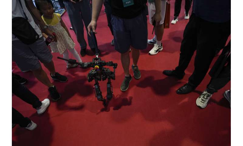 Lifelike robots and android dogs wow visitors at Beijing robotics fair