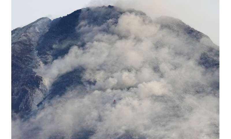 Philippine villagers flee ashfall, sight of red-hot lava from erupting Mayon Volcano