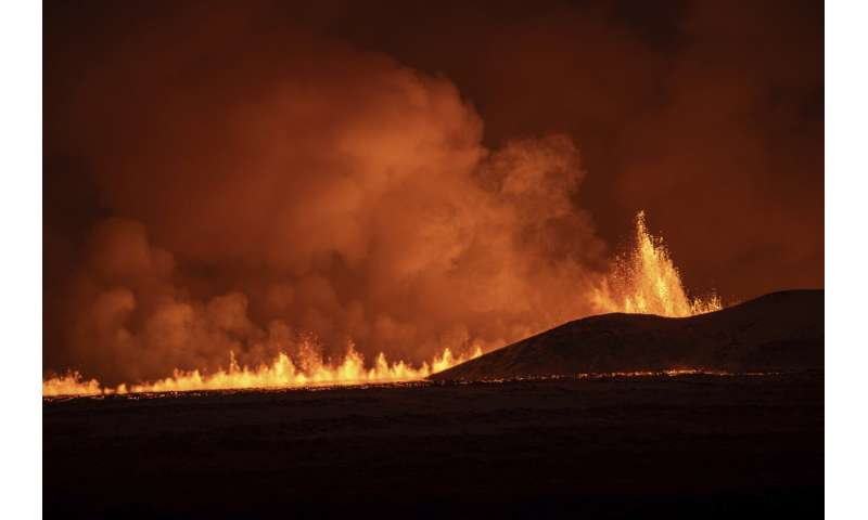 Photos: Rivers and fountains of red-gold volcanic lava light up the dark skies in Icelandic town