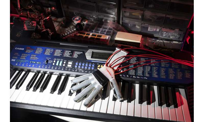 Robotic glove that 'feels' lends a 'hand' to relearn playing piano after a stroke