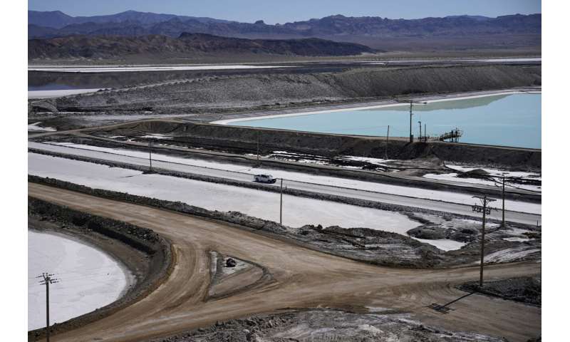 Threatened by shortages, electric car makers race for supplies of lithium for batteries