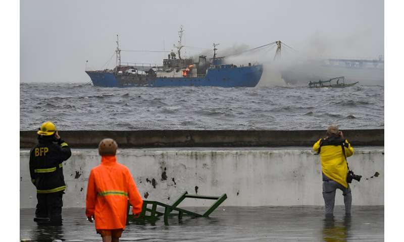 A tug and a small passenger ship collided while both were anchored in Manila Bay, causing a fire aboard the second vessel