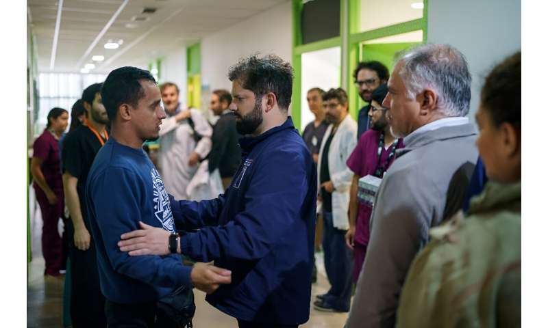 Chilean President Gabriel Boric (C) visits patients affected by the wildfires at a hospital in Vina del Mar on February 4, 2024