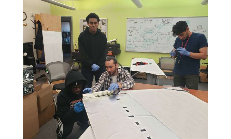 Cosmic ray detectors, built by Utah refugee teens, installed on Refugee Services Center