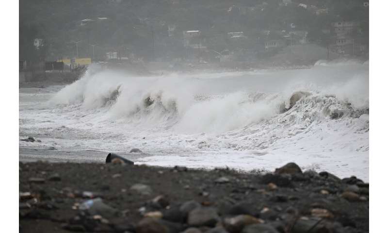 High waves crash along the beach in Kingston, Jamaica, before the arrival of Hurricane Beryl