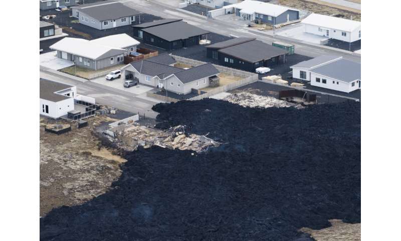 Iceland faces daunting period after lava from volcano destroys homes in fishing town, president says