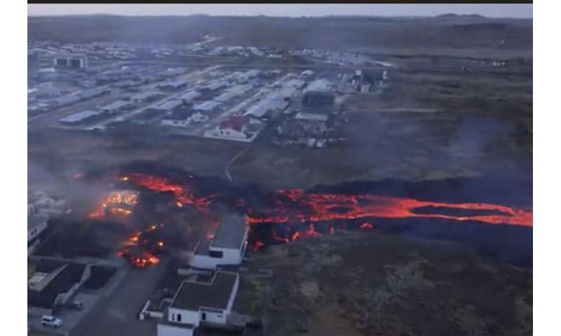 Iceland faces daunting period after lava from volcano destroys homes in fishing town, president says