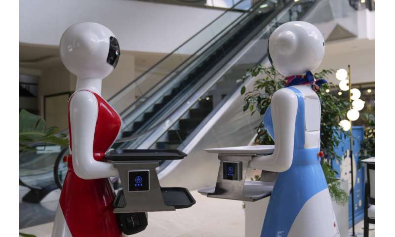 Robot waiters in Kenya create a buzz. But there are concerns about what it means for human labor