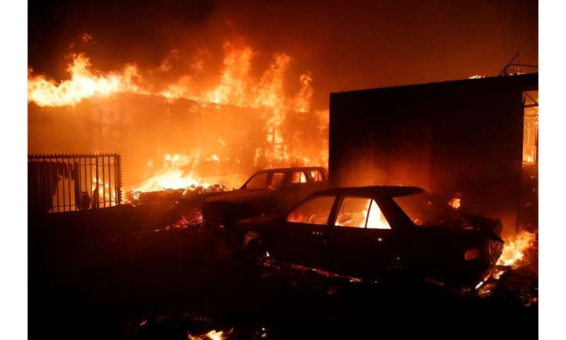 Vehicles and homes burn during a fire in Viña del Mar, Chile, on February 2, 2024