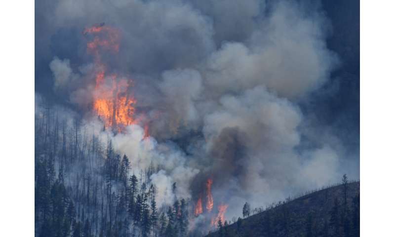 Wildfires encroach on homes near Denver as heat hinders fight