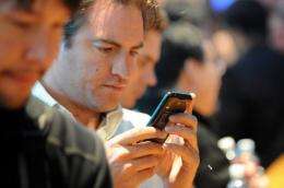 An attendee looks at a Motorola Atrix smartphone
