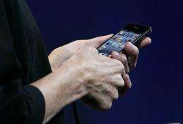 Apple CEO Steve Jobs demonstrates the new iPhone 4
