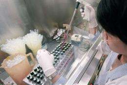 A scientists tests cell samples at a laboratory in Taipei, Taiwan