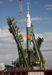A Soyuz TMA-01M spacecraft is transported from the assembly hangar to its launch pad at the Baikonur cosmodrome