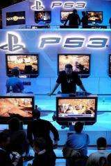Attendees play video games at a Sony Playstation booth