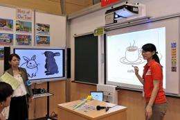 A Uchida Yoko employee demonstrates the company's latest educational products at at a digital education exhibition i