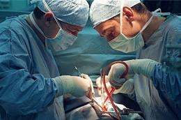 Doctors perform heart surgery