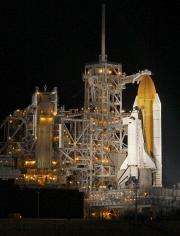 NASA fuels space shuttle 2nd time, clouds back (AP)