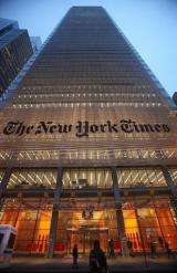 The New York Times' masthead is displayed in front of the midtown headquarters