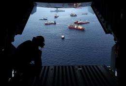 Vessels work at the site of the Deepwater Horizon accident as viewed from inside a Coast Guard flight over the site