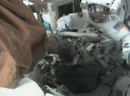 Astronauts tackling antenna work in 1st spacewalk (AP)