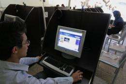 An Iranian youth browses at an Internet cafe in the city of Hamadan in 2009