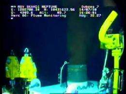 This still image from a live BP video feed shows oil gushing from a leaking BP oil well-pipe