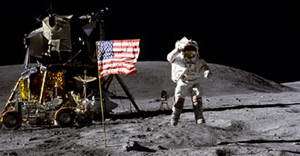 Young salutes the American flag next to the lunar module Orion during the Apollo 16 mission in 1972