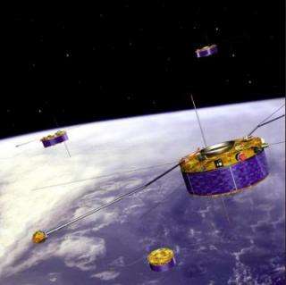 Artist's impression of the ESA Cluster mission, with four spacecraft flying in formation above Earth.
