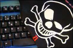 Skull and crossbones over a compuer keyboard