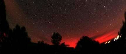 Ruby-colored Northern Lights over Payson, Arizona, on Sept. 11, 2005. Photo credit: Chris Schur