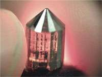 Figure 3. 12 mm (1/2 inch) 5 carat diamond laser cut from a 10 carat single crystal produced by high-growth rate CVD