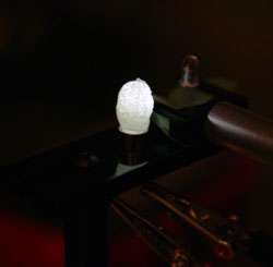 The crude hybrid white-light LED that Bowers made by mixing magic-sized quantum dots with Minwax and using the mixture to coat a