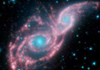 Galaxies Don Mask of Stars in New Spitzer Image